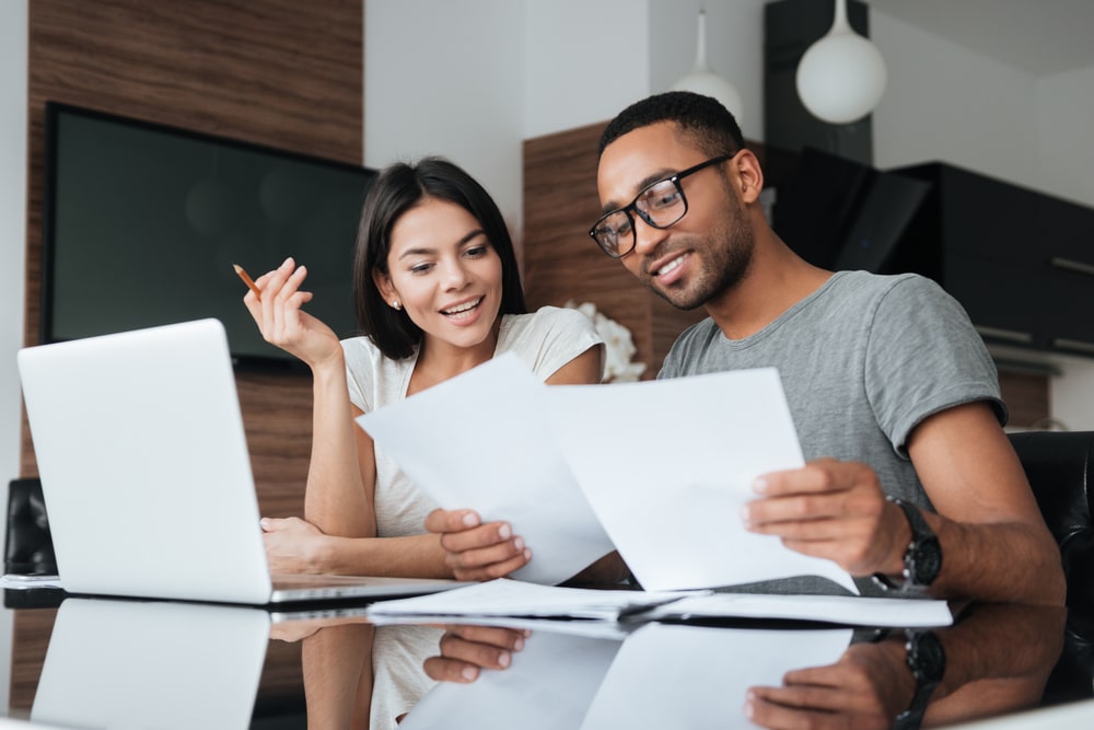Young couple looking at papers together