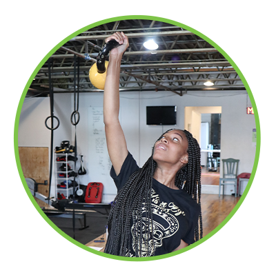 A girl doing kettlebell exercises