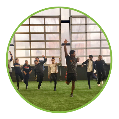 A group doing team stretching at MissionFit